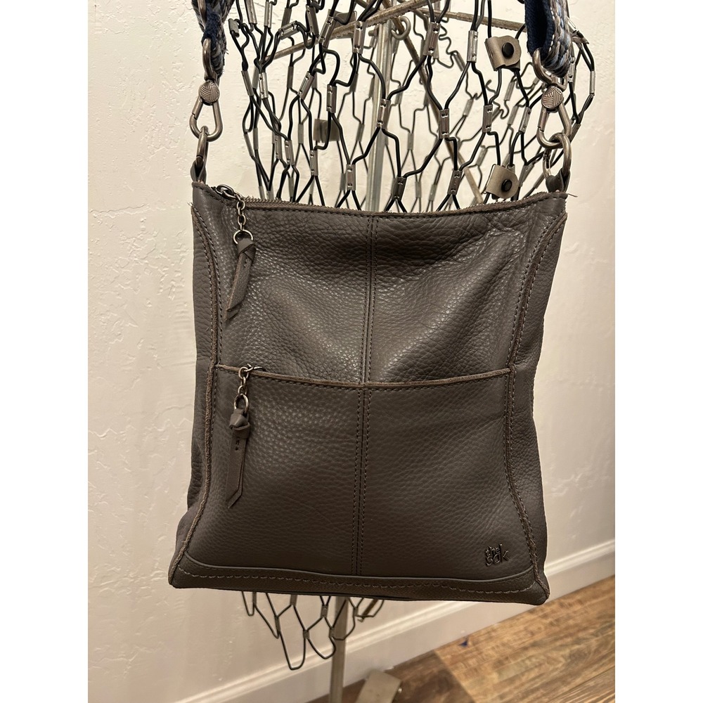 The Sak Gray Pebbled Leather Crossbody Bag with Woven Geometric Strap Messenger